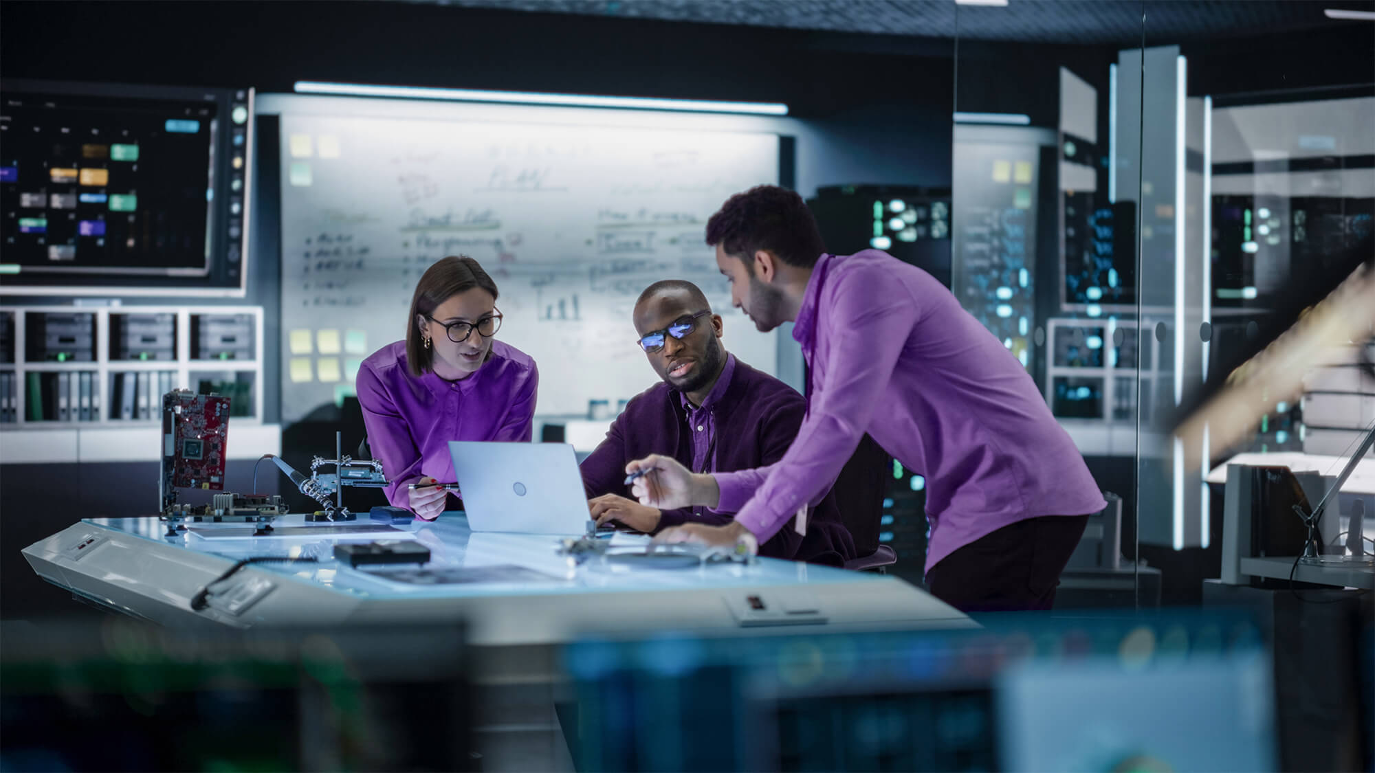 EOSYS engineers at computer