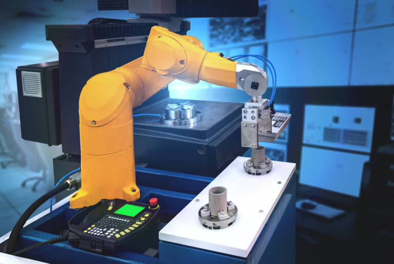 robot picking metal part in a discrete manufacturing process